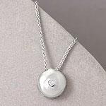 14k White Gold Diamond Accented Circle Pendanr